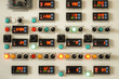 © kosta_iliev - Industrial factory control panel with switches and digital indicators
