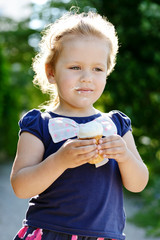 Wall Mural - little girl eating  ice-cream