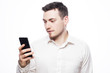 © Raisa Kanareva - happy business man reading an SMS on smartphone