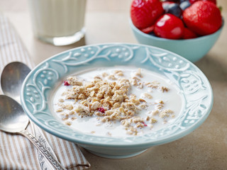 Canvas Print - healthy breakfast granola in a blue plate