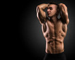 © innervisionpro - Muscular athlete showing impressive body building