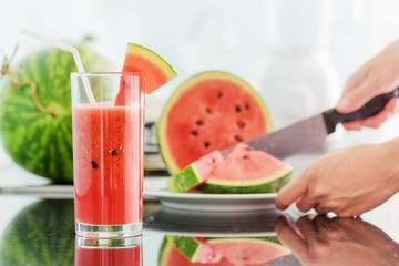 Wall Mural - Glass of fresh watermelon juice on table