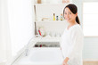 © taka - young asian woman in the kitchen
