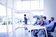 © WavebreakmediaMicro - Businesswoman giving presentation to colleagues