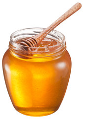 Wall Mural - Glass can full of honey and wooden stick in it. Clipping paths.