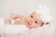 Portrait of newborn baby girl  with white headband