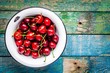ripe juicy cherry in an old bowl