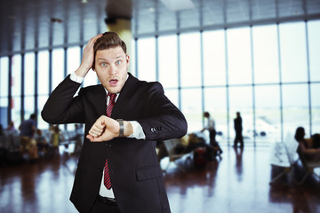 businessman surpised in airport to catch a flight