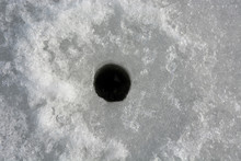 Winter Fishing. Ice Fishing- Hole In The Ice