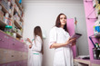 © DC Studio - Pharmacist woman with digital tablet in hands
