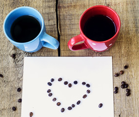 two polka dot mugs and sheet of paper with message