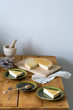 Melopita - traditional greek ricotta and honey cake on wooden table, rustic style still life