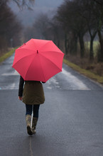 Rainy Day Woman Holding Red Umbrella