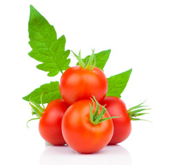 Wall Mural -  fresh tomatoes with green leaves isolated on white background