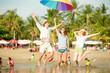 © x4wiz - Group of happy young people having fun on the beach