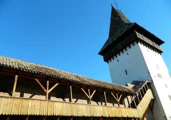 An old fortress tower in the historic city center of Medias, Rom