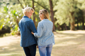 mother and daughter walking outdoors