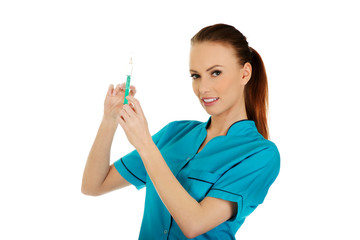 Nurse with a syringe in hand. 