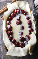 Wall Mural - French puff pastry with cherries before baking