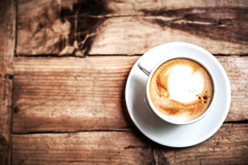 Poster - Cup of Coffee for breakfast on rustic wooden table, top view. Ca