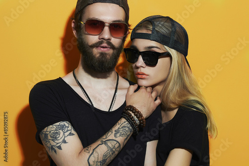 Fototapeta na szkło beautiful couple together. Tattoo Hipster boy and girl