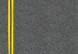 Asphalt road top view with two yellow lines