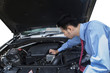 © Creativa Images - Entrepreneur checking the car machine