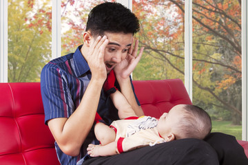 Wall Mural - Father play peekaboo with his baby