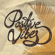 Positive Vibes- hand drawn quote, black on the wrapping paper with palm tree background