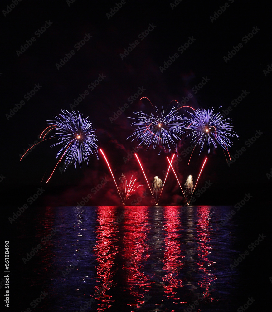 Colorful fireworks with reflection on lake. Stock Photo | Adobe Stock