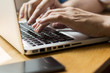 © ilijaa - Close up hands, man using laptop and smart phone
