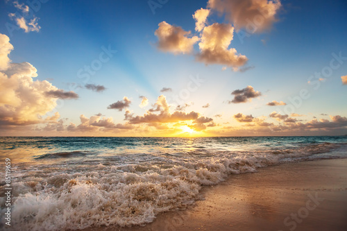 Fototapeta na wymiar Sunrise on the beach of Caribbean sea