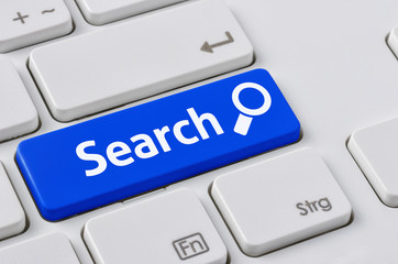 Wall Mural - a keyboard with a blue button - search