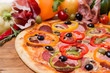 © sytnik - hot pizza with garnish and components