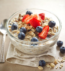 Wall Mural - healthy breakfast, bowl of muesli with milk