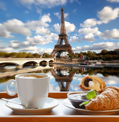 Wall Mural - Coffee with croissants against Eiffel Tower in Paris, France