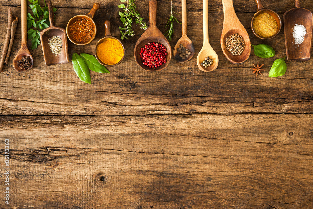 Colorful spices on wooden table - obrazy, fototapety, plakaty 
