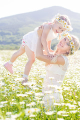 Wall Mural - Family mother and child having fun outdoors