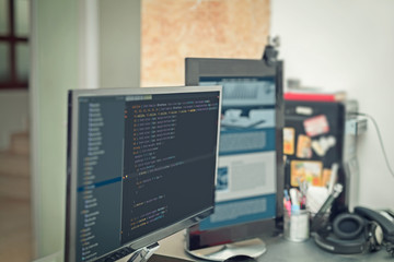 web site codes on computer monitor ar office
