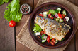 Baked seabass with Greek salad. 