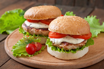 Appetizing hamburger with chicken burger and sauce Tartar