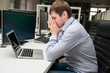© visochin_o - Young handsome man with computer in the office. Thinking over ta