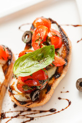 Canvas Print - Bruschetta with tomato, mozarella and basil