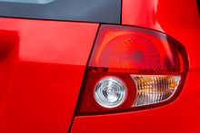 Red Rear Stop Lights On The Red Car, Close View