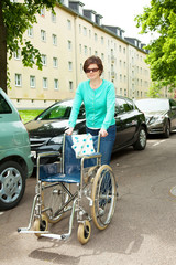 Poster - Caregiver pushes wheelchair