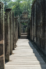 Naklejka na meble interior of a gallery in ruins in the complex of the bayon in the archaeological angkor thom place in siam reap, cambodia