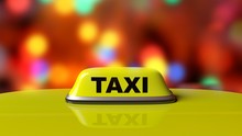 Yellow Taxi Car Roof Sign With Abstract Bokeh City Lights Background