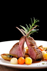 Fine dining, roasted Lamb chops with potato, rosemary and vegetable sauce