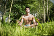 © theartofphoto - Young Man Meditating or Doing Outdoor Yoga Exercise