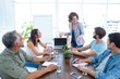 © WavebreakMediaMicro - Businesswoman giving a presentation